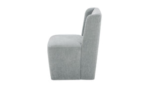 lifestyle view of Cormac Rolling Dining Chair Performance Fabric Slate Green luxury Chair