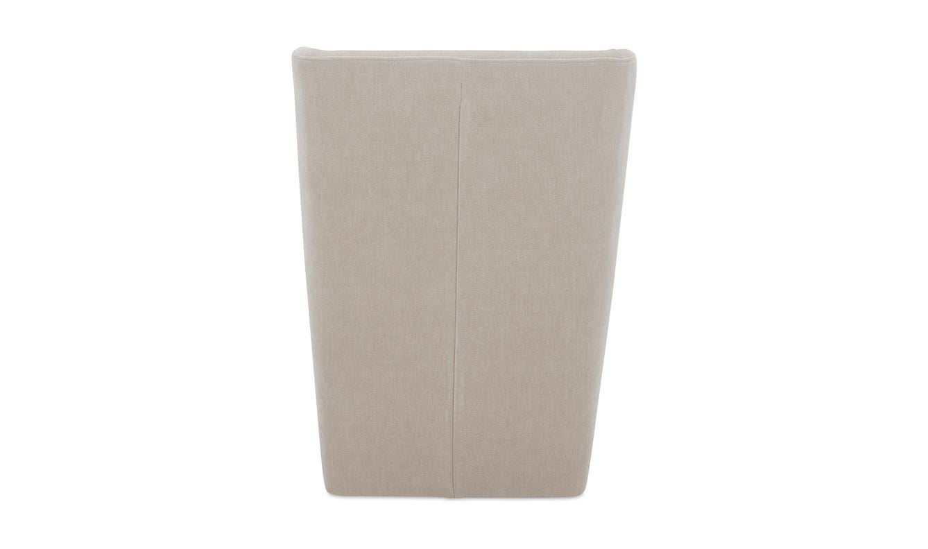 lifestyle view of Cormac Rolling Dining Chair Performance Fabric Warm Sand luxury Chair