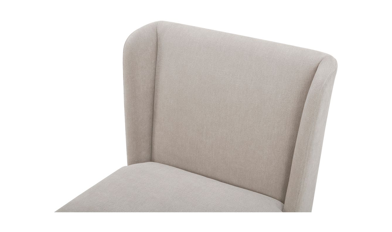 lifestyle view of Cormac Rolling Dining Chair Performance Fabric Warm Sand luxury Chair