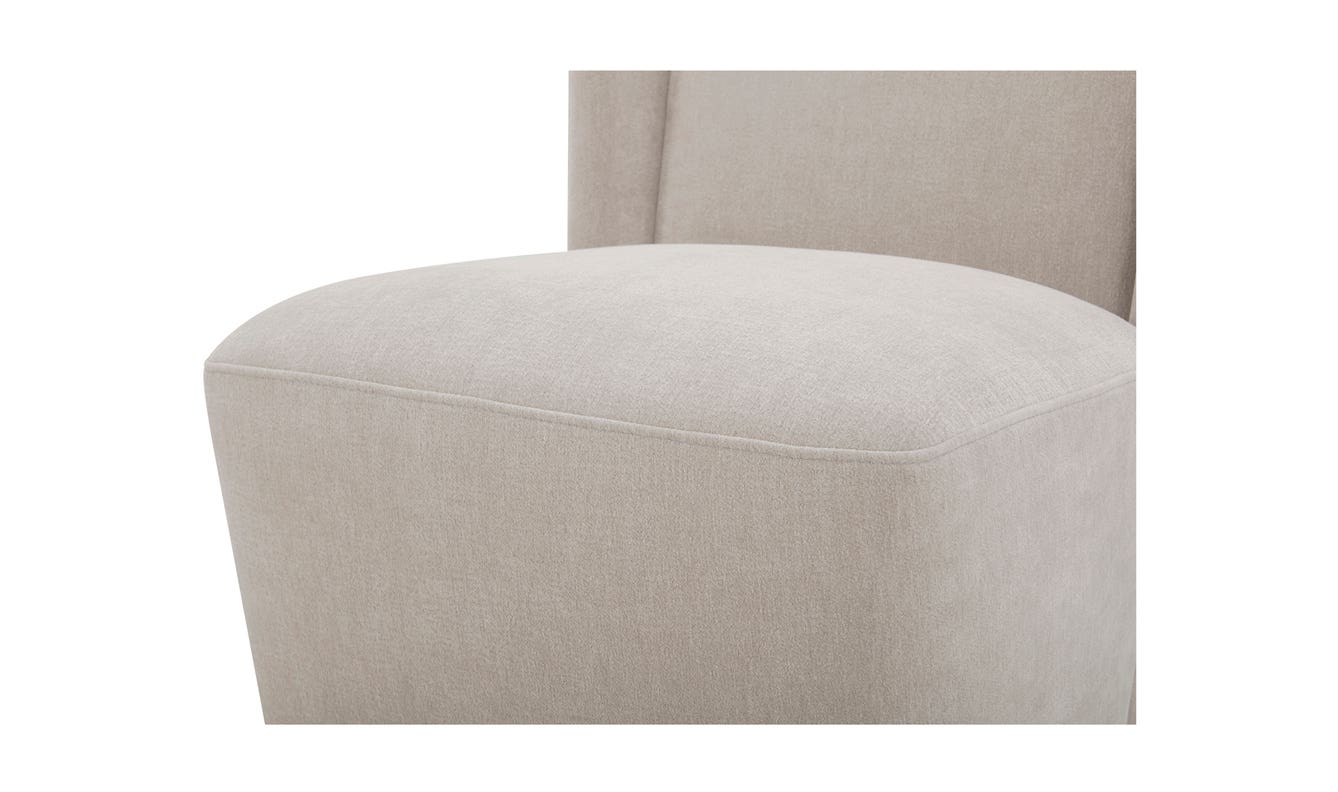 lifestyle view of Cormac Rolling Dining Chair Performance Fabric Warm Sand luxury Chair