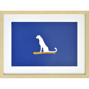 Makalu Wall Art featuring a white dog silhouette on a blue background with gold accents
