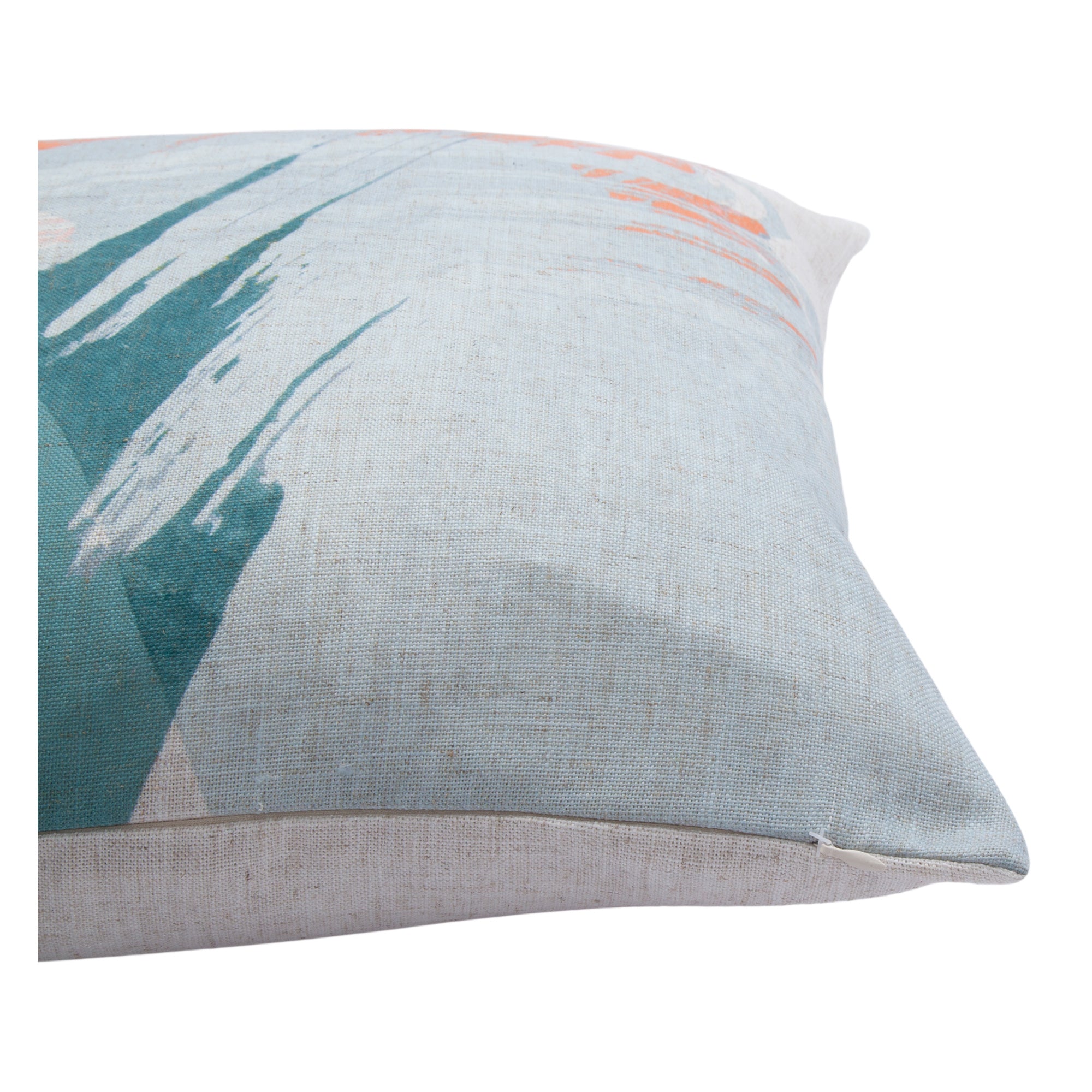 Close-up of Tavira indoor pillow highlighting textured fabric and abstract patterns in orange and teal