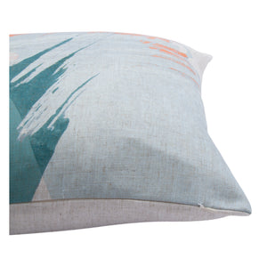Close-up of Tavira indoor pillow highlighting textured fabric and abstract patterns in orange and teal