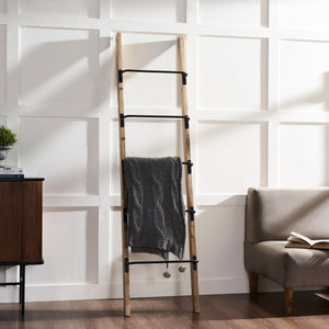 Marieta Blanket Ladder displaying a gray blanket, styled in a modern living room