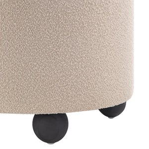 Beige Claude Ottoman with a plush surface and black rounded legs