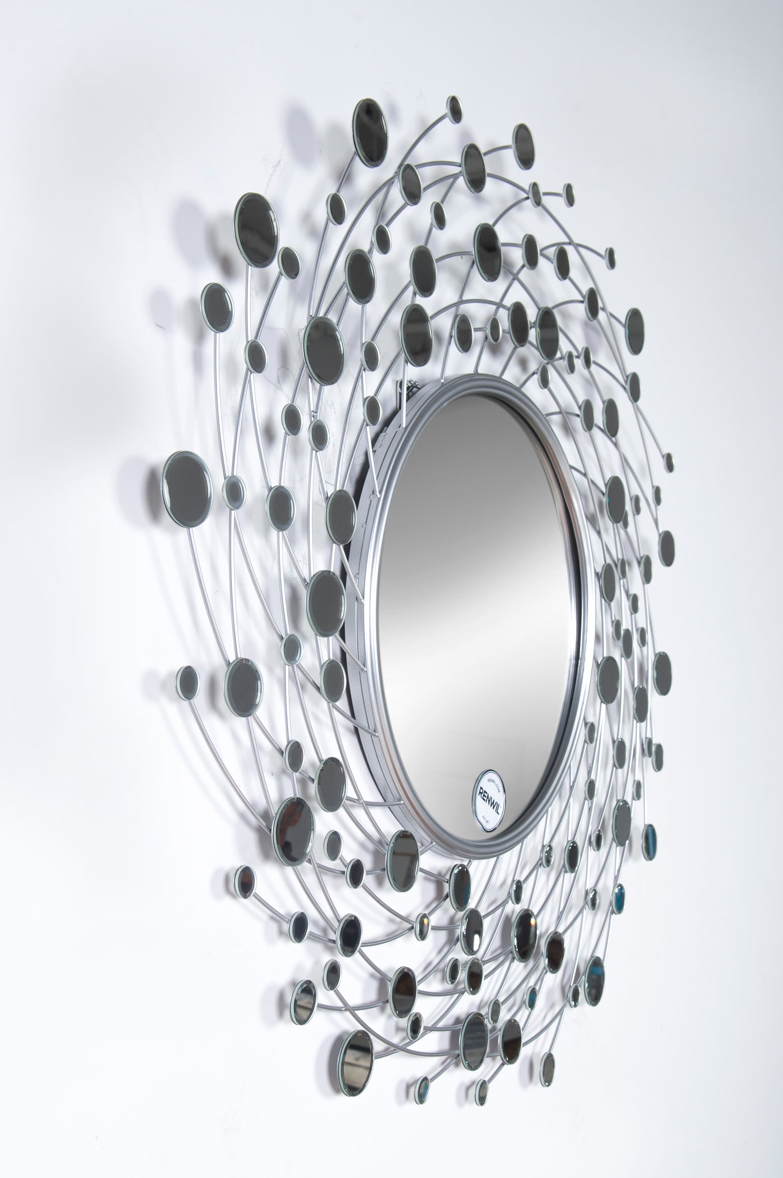 Como Wall Mirror with a circular center surrounded by a swirling silver wire design and reflective circles.