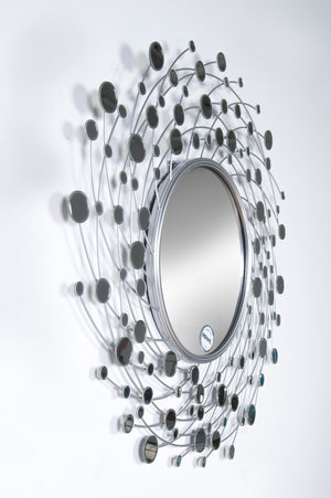 Como Wall Mirror featuring a round shape with a silver wire frame and multiple reflective oval accents.