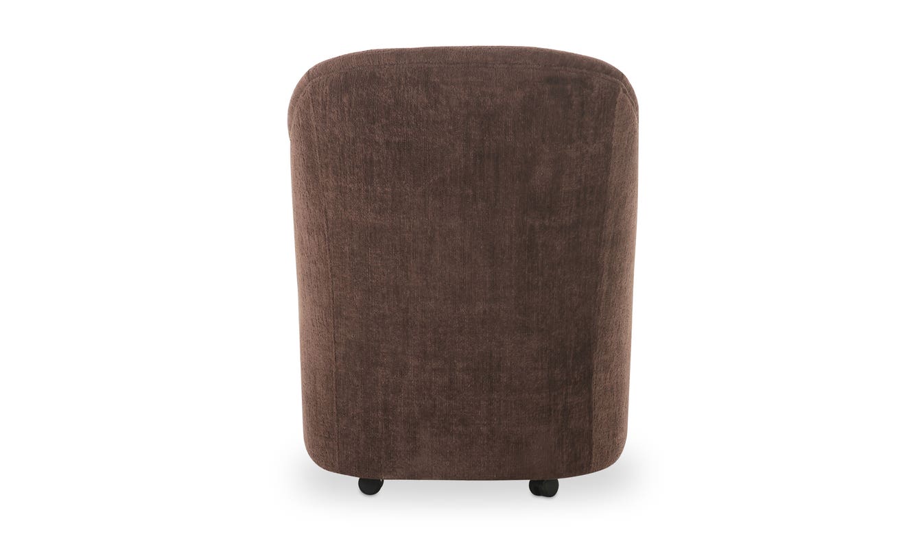 lifestyle view of Drava Rolling Dining Chair luxury Chair