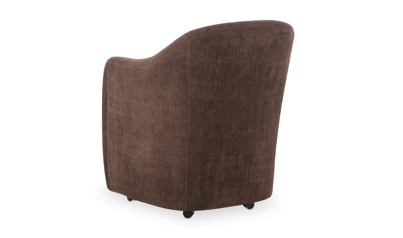 lifestyle view of Drava Rolling Dining Chair luxury Chair