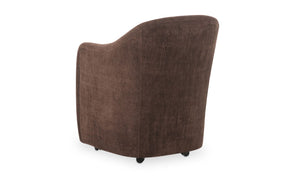 lifestyle view of Drava Rolling Dining Chair luxury Chair