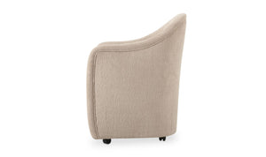 lifestyle view of Drava Rolling Dining Chair luxury Chair