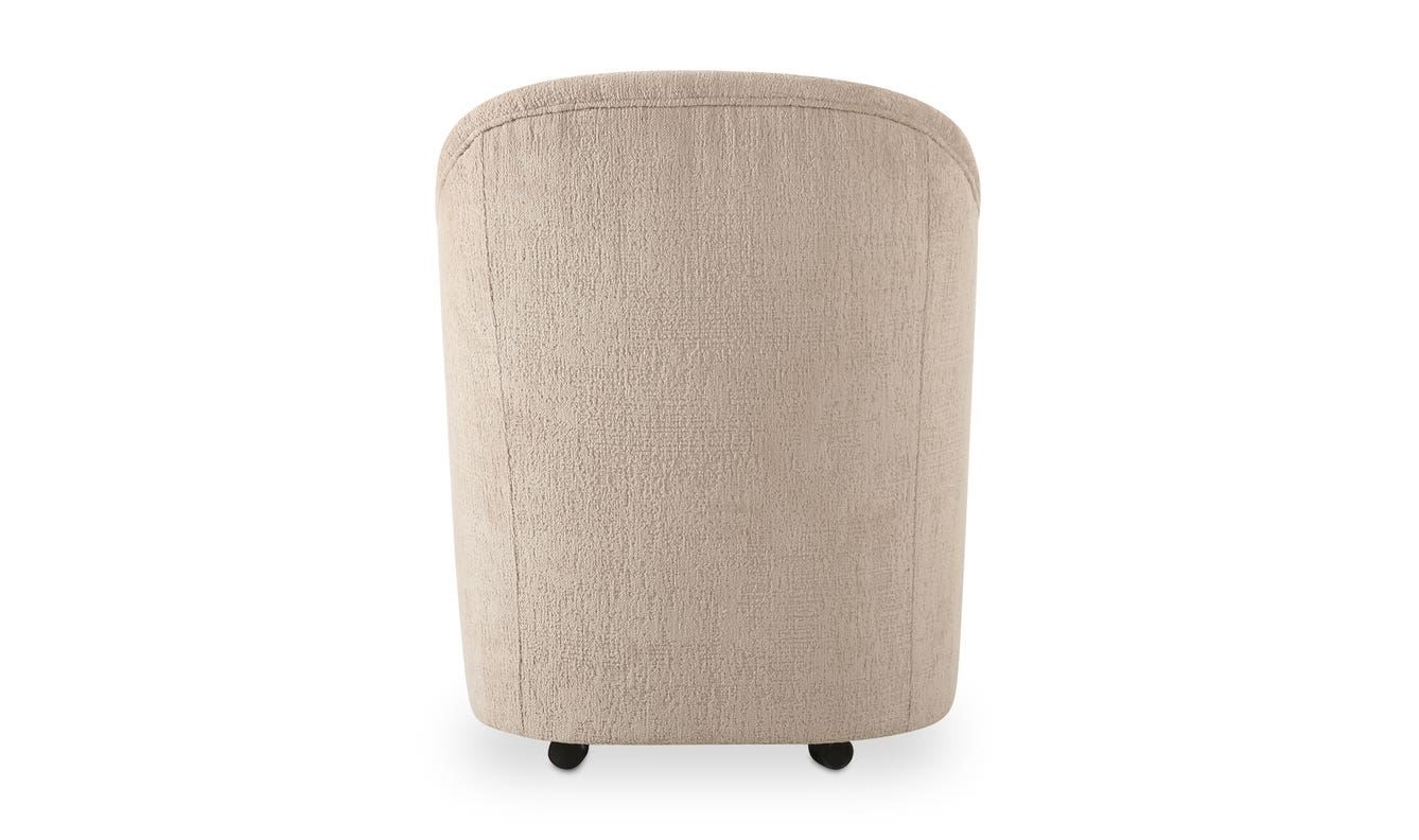 lifestyle view of Drava Rolling Dining Chair luxury Chair