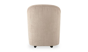 lifestyle view of Drava Rolling Dining Chair luxury Chair