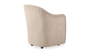 lifestyle view of Drava Rolling Dining Chair luxury Chair