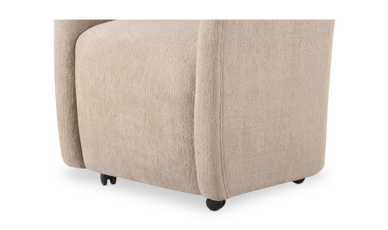 lifestyle view of Drava Rolling Dining Chair luxury Chair