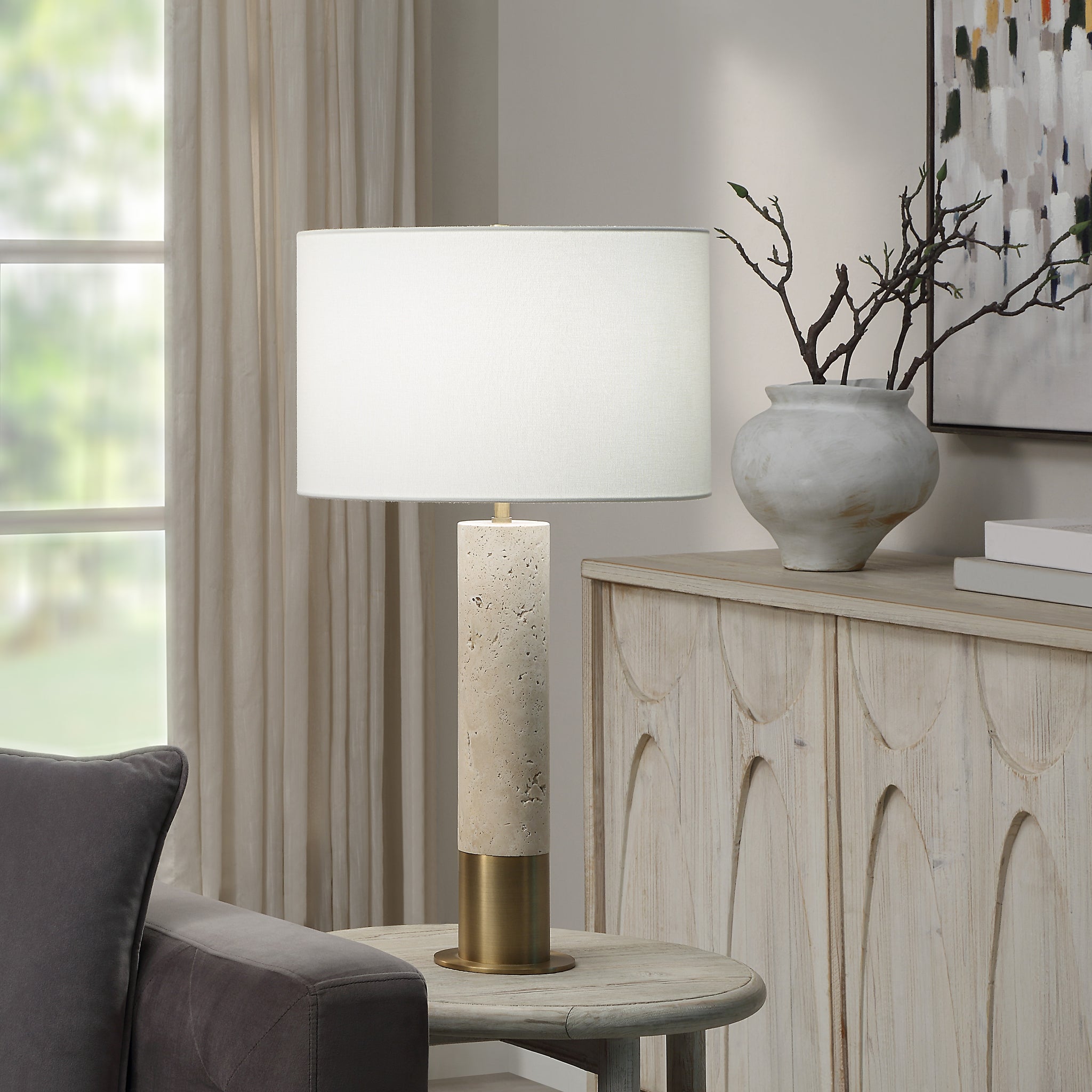 Amadora table lamp on a side table in a living room setting
