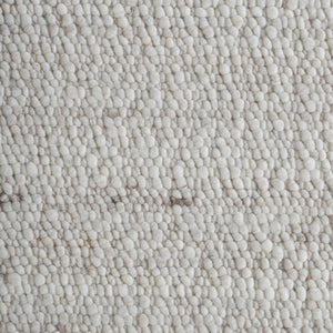 Close-up of Meghan rug showing soft, plush texture in light beige with subtle variations.