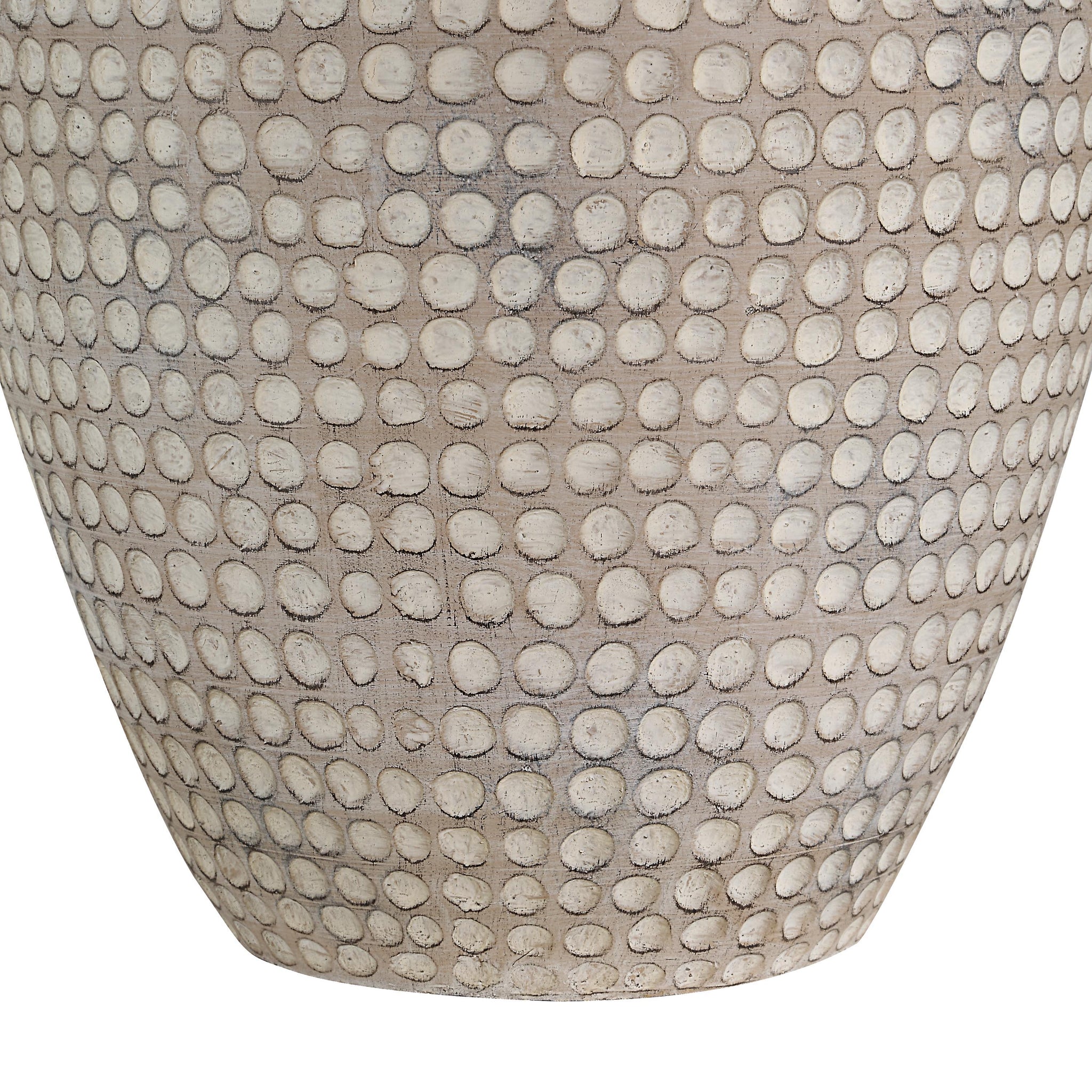 Close-up of Albacete table lamp's beige ceramic base featuring a dotted pattern.