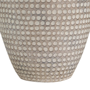Close-up of Albacete table lamp's beige ceramic base featuring a dotted pattern.