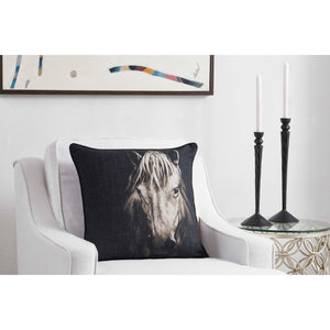 Del Rio Indoor Pillow on a white chair, showcasing a horse design
