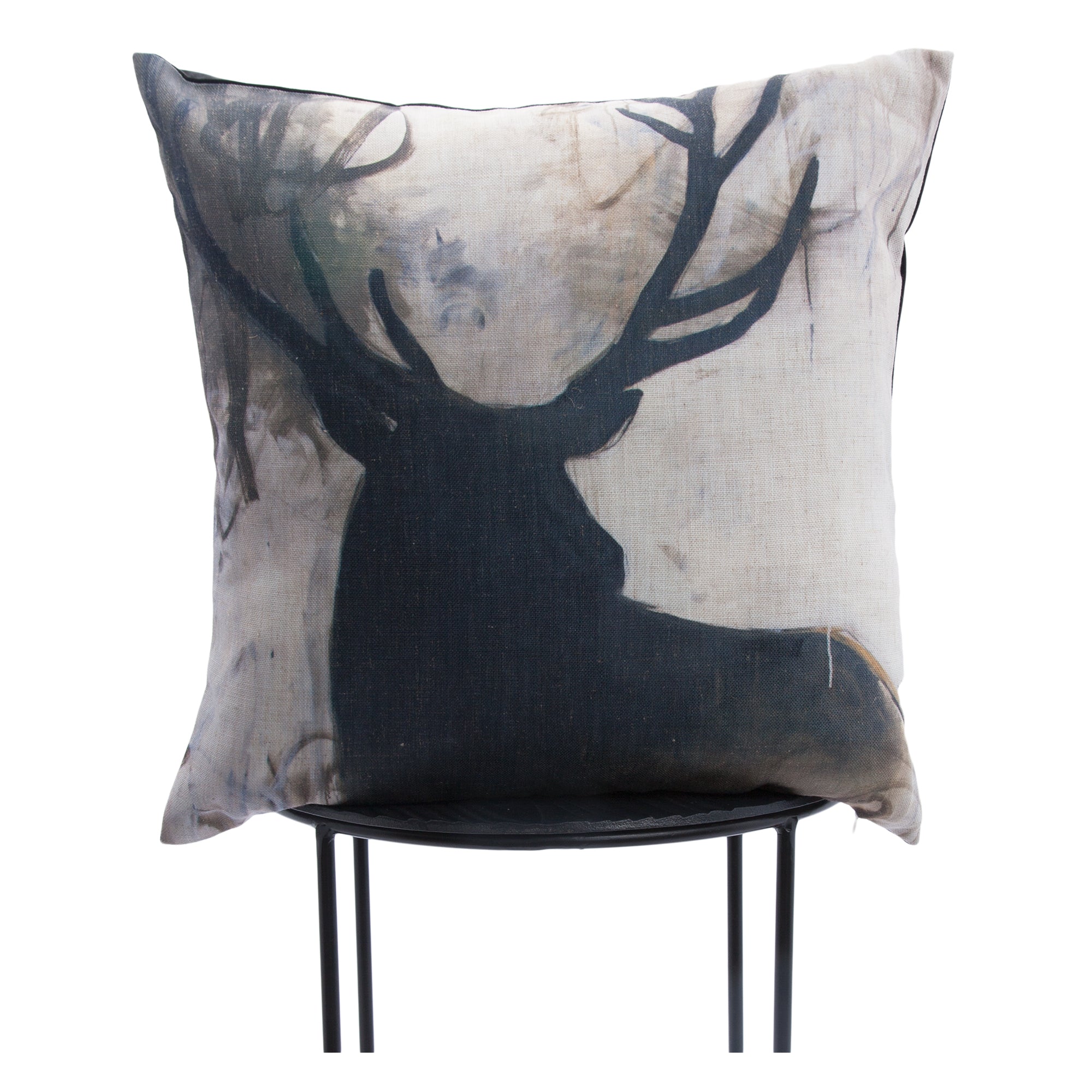 Percy indoor pillow displaying a deer silhouette against a soft, muted background, positioned on a chair.