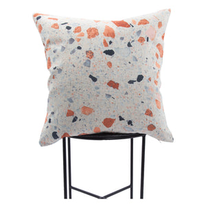 Castelo Indoor Pillow displayed on a black metal chair, showcasing a colorful speckled design.