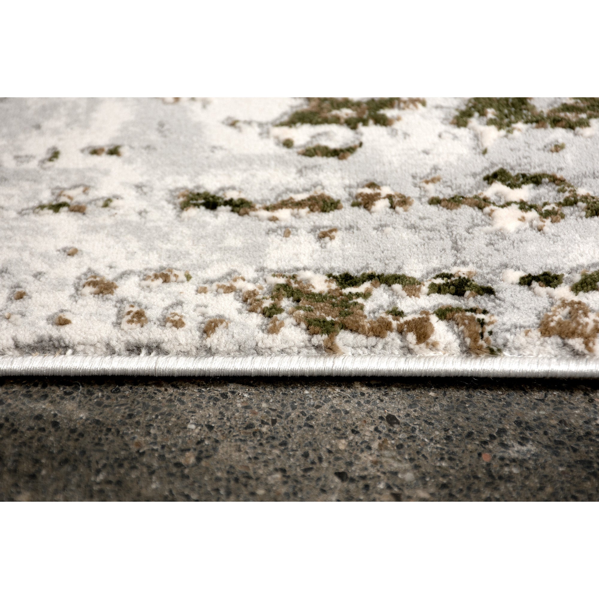 Side view of the Ariella Indoor Rug, emphasizing its plush texture and color variations.