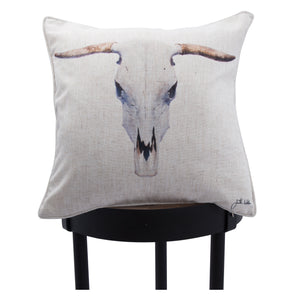 Elgin pillow showcasing a bull skull print, displayed on a black stool.