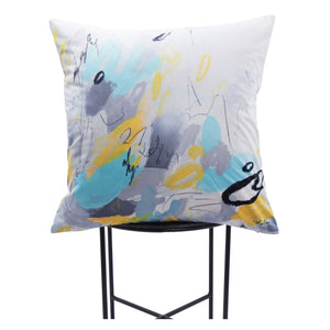Faro indoor pillow featuring colorful abstract patterns in blue, gray, and yellow, displayed on a black metal stand.