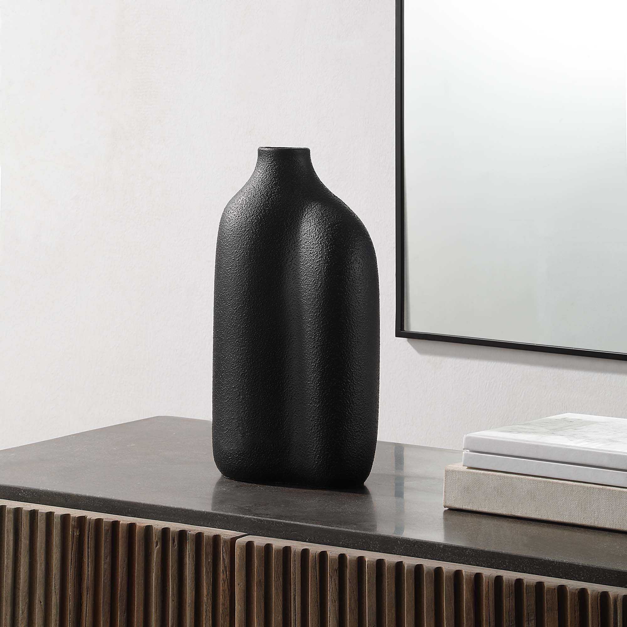Challenger Vase by Renwil displayed on a table, featuring a black textured finish and modern decor.