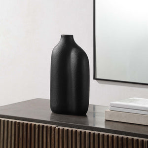 Challenger Vase by Renwil displayed on a table, featuring a black textured finish and modern decor.