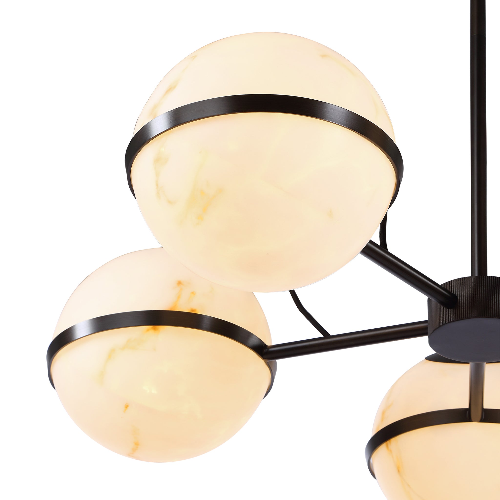 Roca ceiling fixture showcasing three lit white marble globes with black metal rings, close-up view.