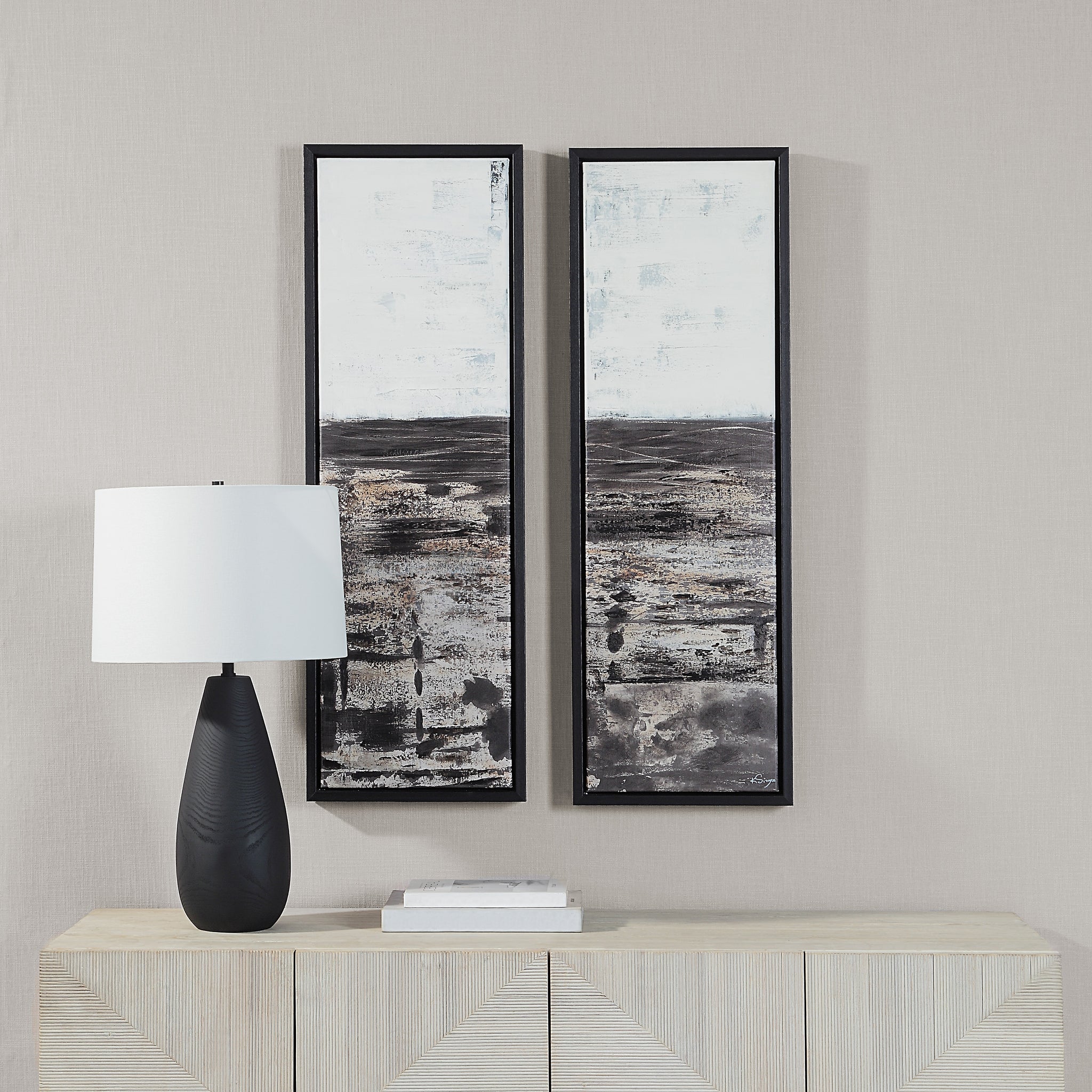 Spica canvas art displayed on a wall above a side table with a black lamp and decor.