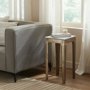 Abby Side Table beside a gray sofa, styled with a book and candle