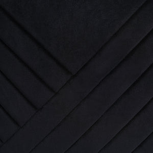 Close-up of Diran Indoor Pillow in black showcasing diagonal quilted texture