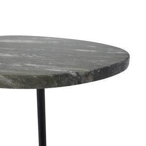 Close-up of Adeline Side Table's black marble surface showcasing its texture and color variations.