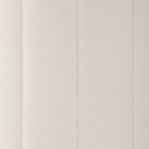 Detailed view of Baylor Ottoman's beige fabric with vertical seams