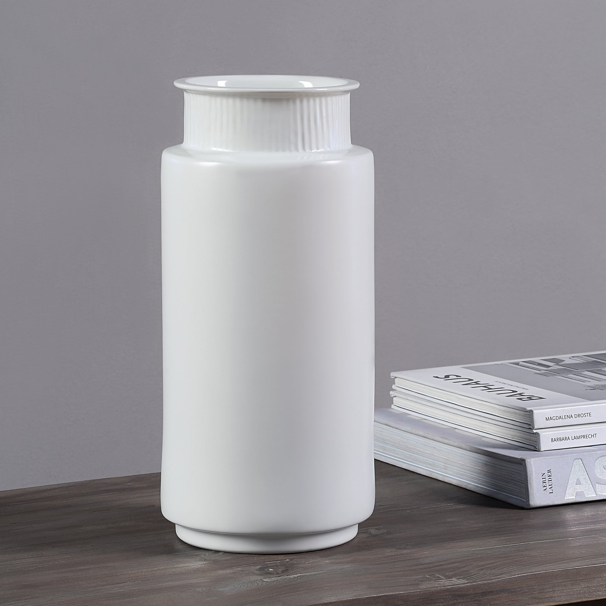 Zena Vase by Renwil, white ceramic vase displayed on a wooden table with magazines
