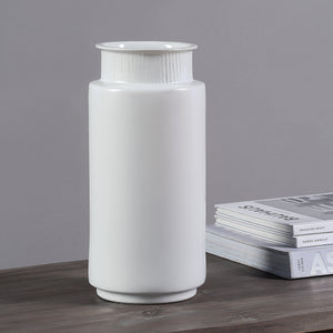 Zena Vase by Renwil, white ceramic vase displayed on a wooden table with magazines