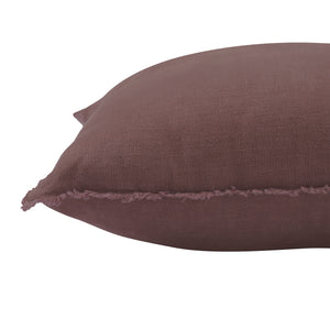 Detailed side view of Pan Indoor Pillow in brown, emphasizing the frayed seam.