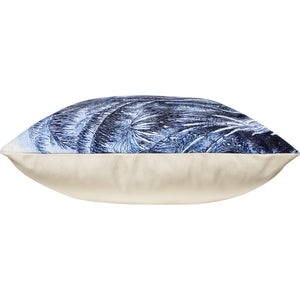 Side view of Jona Indoor Pillow displaying blue palm tree design and cream-colored bottom.