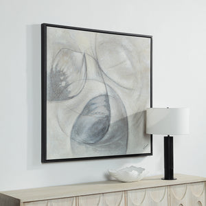 Webb canvas art hung on a wall next to a lamp and decorative bowl, featuring abstract gray and black shapes.