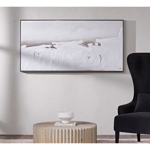 Blanche canvas art mounted on a wall above a round wooden table and black chair