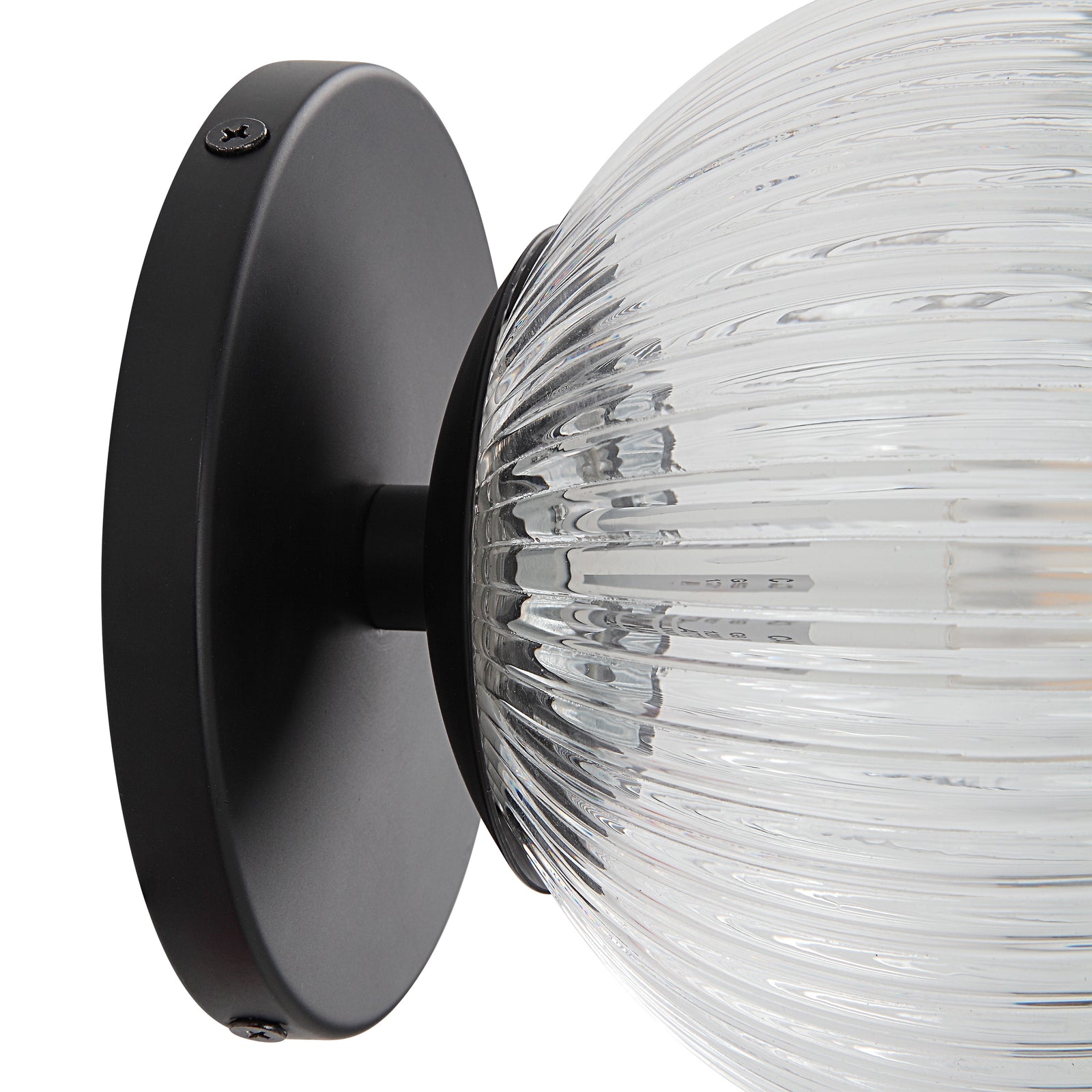 Brian Wall Sconce with clear ribbed glass globe and black metal base, side view.