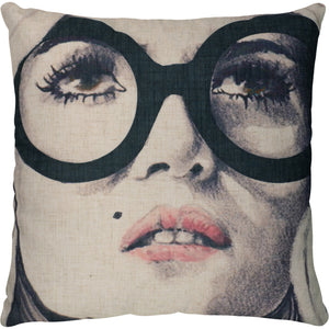 Madelia Indoor Pillow featuring a graphic face design with large glasses on a beige background.